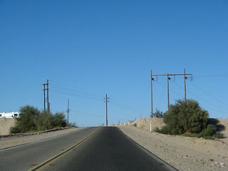 A flurry of power lines owned by the Imperial Irrigation District cross California 186. Shortly, California 186 will cross the All American Canal, which is the primary diversion of Colorado River water west to the Imperial Valley.