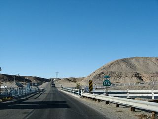 The All American Canal is the principal route for Colorado River water to be delivered to the farms and ranches of the Imperial Valley. In addition, the canal supplies some urban areas and areas served by the East Highline Canal. This bridge, built in 1938, carries California 186 over the canal. Plans call for the canal to be lined with concrete starting in 2007, which would reduce the amount of water that seeps into the ground. This has angered local farmers in the Imperial Valley as well as people in Mexico who rely on the seepage to supply the groundwater. Controversy follows water throughout the West, and the Colorado River diversion into the All American Canal is no exception.
