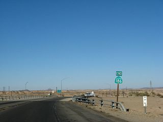 An end California 186 shield is posted prior to the bridge crossing over Interstate 8. California 186 is one of the few state routes that have an end shield assembly at both ends of the route. Another example in Catrans District 11 is California 163, which also has end shield assemblies at both ends.