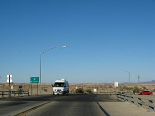 Crossing over Interstate 8, the next left is the connection to Interstate 8 west to Holtville, El Centro, and San Diego. For Old U.S. 80 west, exit onto Interstate 8 west. Continuing straight ahead, the state highway converts into Old U.S. 80 / Araz Road east to Winterhaven.