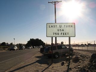 A large parking lot appears on the west side of California 186 for pedestrian traffic entering Mexico. Otherwise, all traffic on California 186 will default into crossing the border into Mexico. The only chance to turn around is the last U.S. U-Turn, which is 750 feet ahead. On the west side of the road, almost lost in the many parked vehicles, is Hanlon Heading, an old water diversion facility built in 1905.