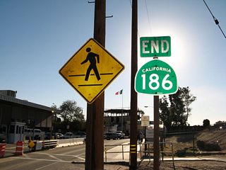 Shortly afterward, California 186 comes to an end. The U.S. Customs Station is located here, and the through lane will connect to the Mexican Port of Entry.