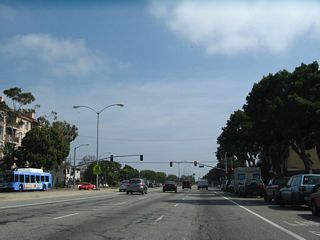 Eastbound California 187 (Venice Boulevard) approaches Walgrove Avenue.