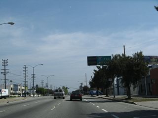 Eastbound California 187 (Venice Boulevard) approaches National Boulevard, which also connects to Interstate 10.