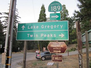 Lake Gregory Drive extends northwest from the eastern turn of SR 189 to Arrowhead Highlands and Lake Gregory at Crestline.