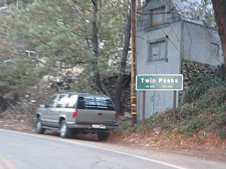 Resuming a westward course after Daley Canyon, SR 189 proceds into the unincorporated community of Twin Peaks.