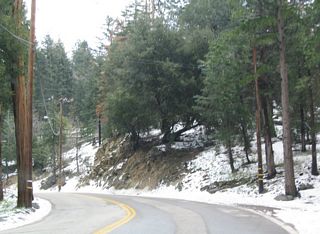 Snow along SR 189 is common in the Winter and early Spring due to the high elevation despite being fairly far to the south in the state.