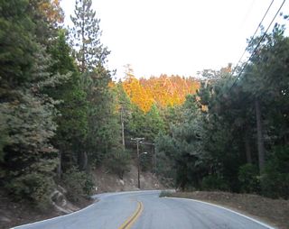 Continuing southwest from Twin Peaks, SR 189 runs between Strawberry Flat and Strawberry Peak.