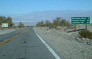 Eastbound California 190 meets Wildrose Road (Emigrant Canyon cutoff) nine miles west of Stovepipe Wells.