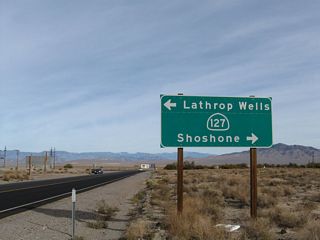 Eastbound California 190 approaches California 127, which leads north to Amargosa Valley, Nevada (formerly Lathrop Wells) and south to Shoshone. Services are available in both communities. This sign was placed in late 2001 or early 2002.
