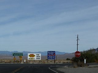 A stop sign and arrow warning sign are posted at the "end of the line" for California 190 east at the intersection with California 127 in Death Valley Junction. No services are available here.