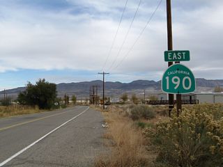 The first reassurance shield for California 190 east is found after the intersection with U.S. 395 in the unincorporated community of Olancha in Inyo County. From here, California 190 proceeds northeast around the southern edge of mostly dry Owens Lake toward a rendezvous with California 136.