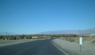 California 190 west approaches Furnace Creek, a visitors center located within Death Valley National Park. All services are available here.