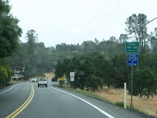 Northbound California 191 (Clark Road) enters the town of Paradise. Paradise had a population of 26,218 as of the 2010 Census and incorporated as a town on November 27, 1979. It sits at an elevation of 2,050 feet.