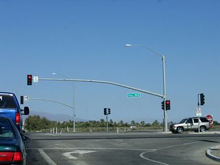 Eastbound 66th Avenue meets the California 86 expressway at this traffic signal.