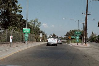 Past Lemoore and Hanford, California 198 becomes a freeway, then an expressway en route to Visalia. Just west of Visalia, California 198 again becomes a freeway. This freeway entrance sign for California 198 is located in Visalia.