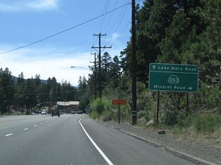 Westbound California 203 (Main Street) approaches the next traffic signal at Lake Mary Road and Minaret Road. Turn left to follow Minaret Road south, continue straight for Lake Mary Road south to Mammoth Lakes, or turn right for the continuation of California 203 west to Mammoth Mountain and Devils Postpile.