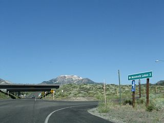 At the turnoff to U.S. 395 north is this mileage sign for California 203 west to the town of Mammoth Lakes (three miles).