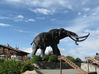 A large wooly mammoth statue sits next to the gondola terminal and visitors center near Mammoth Mountain Resort.