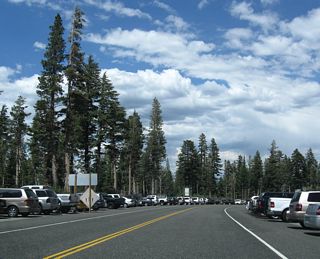 Leaving Mammoth Mountain resort, eastbound California 203 sees overflow parking along both sides of the state route. This parking area is the place to park when visiting Devils Postpile and Reds Meadow.