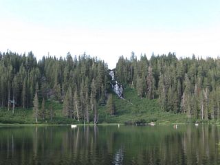 The Mammoth Lakes lie at the southwestern end of Lake Mary Road. Namesake Lake Mary is the largest of the many lakes in this basin. Activities here include camping, hiking, swimming, and fishing. A towering rock formation (Crystal Crag) can be seen from around the lakes, offering a unique view. Volcanic activity around the lakes has resulted in some tree die-off, and warnings persist about the possibility of eruption.