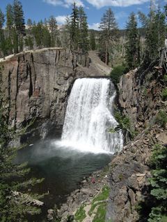 Water flowing along the Middle Fork of the San Joaquin River drops 101 feet at Rainbow Falls.