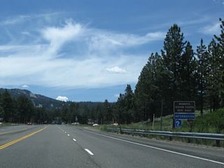 Westbound California 203 meets the turnoff to Mammoth Lakes Visitor Center.