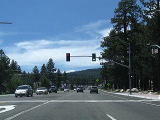 The first signalized intersection along California 203 (Main Street) west is with Old Mammoth Road. Old Mammoth Road leads southwest, joining with Lake Mary Road before reaching the Mammoth Lakes south of town.