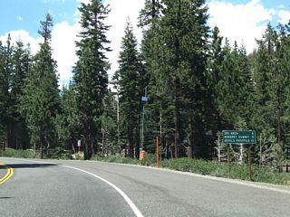 This mileage sign along California 203 west provides the distance to Mammoth Mountain (four miles), Minaret Summit (five miles), and Devils Postpile National Monument (13 miles). The state route ends at Minaret Summit, and access to Devils Postpile requires a trip on a shuttle bus when in-season between 7:00 a.m. and 7:00 p.m.