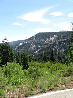 Riding the shuttle bus toward Agnew Meadows along Minaret Road, the majestic Sierra Nevada rise on both sides of the highway.