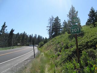 California 207 ends as it enters the permit area for the Bear Valley Mountain Resort. The endpoint comes a bit prior to the actual parking lot. The end shield seems to have been hit and battered a few times.