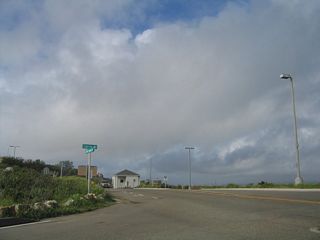 State Route 209 formerly began along Cabrillo Memorial Drive north beyond the main parking lot of Cabrillo National Monument. This view is at the intersection of Cabrillo Memorial Drive and Cabrillo Road just south of the entrance station and fee booth for the national monument.