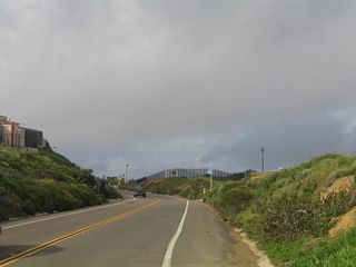 The initial section of Cabrillo Memorial Drive is surrounded by the Fort Rosecrans Military Reservation, and access through the reservation is limited to certain hours (south of Mills Street). A gate is located south of Mills Street to regulate traffic flow into the reservation.