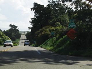 An SR 209 reassurance shield followed Woodward Road along southbound Cabrillo Memorial Drive.