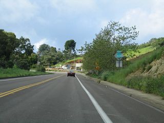 Canon Street (old SR 209) carries two lanes through a picturesque canyon with limited development on either side of the former state route.