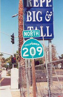 Rosecrans Street expands to a six lane commercial boulevard north through the Midway-Sports Arena area. This SR 209 shield preceded Midway Drive.