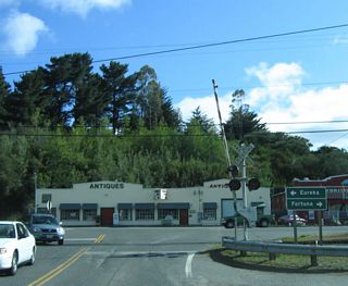 SR 211 makes an unmarked turn onto Fernbridge Drive west to U.S. 101 at Singley Road. Fernbridge Drive is the pre-freeway alignment of U.S. 101.