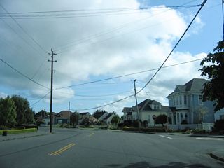 Northbound California 211 (Main Street) meets Herbert Street at this intersection in Ferndale.