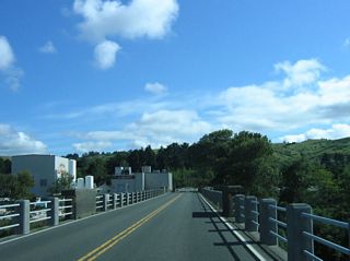 The north end of the Fernbridge enters the unincorporated community of Fernbridge adjacent to a creamery.