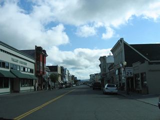 California 211 north begins at the intersection of Ocean Avenue and Main Street at the south end of the historic downtown area.