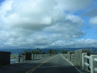 After ascending the Fernbridge, California 211 crosses the wide Eel River. Note the change in bridge railings that is visible at this point on the bridge.