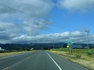 A California 211 south reassurance shield is posted shortly thereafter as the state highway continues to Ferndale.