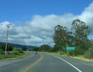 Southbound California 211 approaches Port Kenyon Road, which travels west to serve farm and ranch access northwest of the city of Ferndale.
