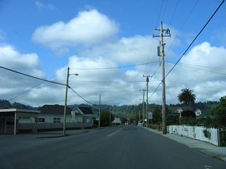 California 211 (Main Street) passes through residential areas south ahead of the Ferndale business district.