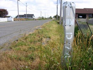 Market Street and Port Kenyon Road form an old alignment of California 211, which was originally signed as California 1. This remnant postmile marker is located along Market Street just north of California 211 near Ferndale. When California 1 was rerouted to end at U.S. 101 at Leggett in 1984, the unconstructed portion of California 1 and this orphaned stretch from Ferndale northeast to Fernbridge was redesignated as California 211. At the same time, California 1 was rerouted onto former California 208 from the coast to Leggett in Mendocino County.
