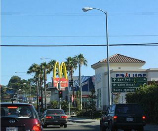 The only state highway intersected by California 213 is California 1 (Pacific Coast Highway). This mileage sign provides the distance to the California 1 (Pacific Coast Highway) destinations of Long Beach (south/east) and Santa Monica (north/west). Continue south on California 213 to San Pedro and Rancho Palos Verdes.