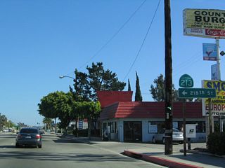 Southbound California 213 (Western Avenue) reaches 218th Street after the Carson Street intersection. A left on 218th Street leads into the Harbor Gateway community of Los Angeles.