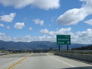 Eastbound California 217 (Clarence Ward Memorial Boulevard) reaches Exit 1, Sandspit Road and Moffett Place to Goleta Beach County Park and Santa Barbara Municipal Airport. This bridge carries California 217 over the Goleta Slough and Moffett Place.