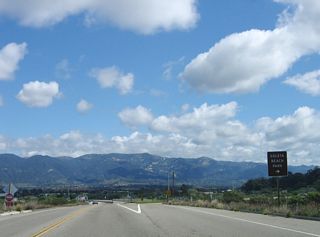 A late sign advises using Exit 1, Sandspit Road and Moffett Place to Goleta Beach County Park.