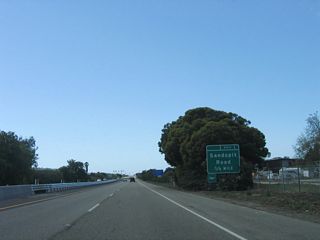 Sandspit Road is a short connector road between California 217 and Moffett Place. Turn north on Moffett Place to the Santa Barbara Municipal Airport terminal building.